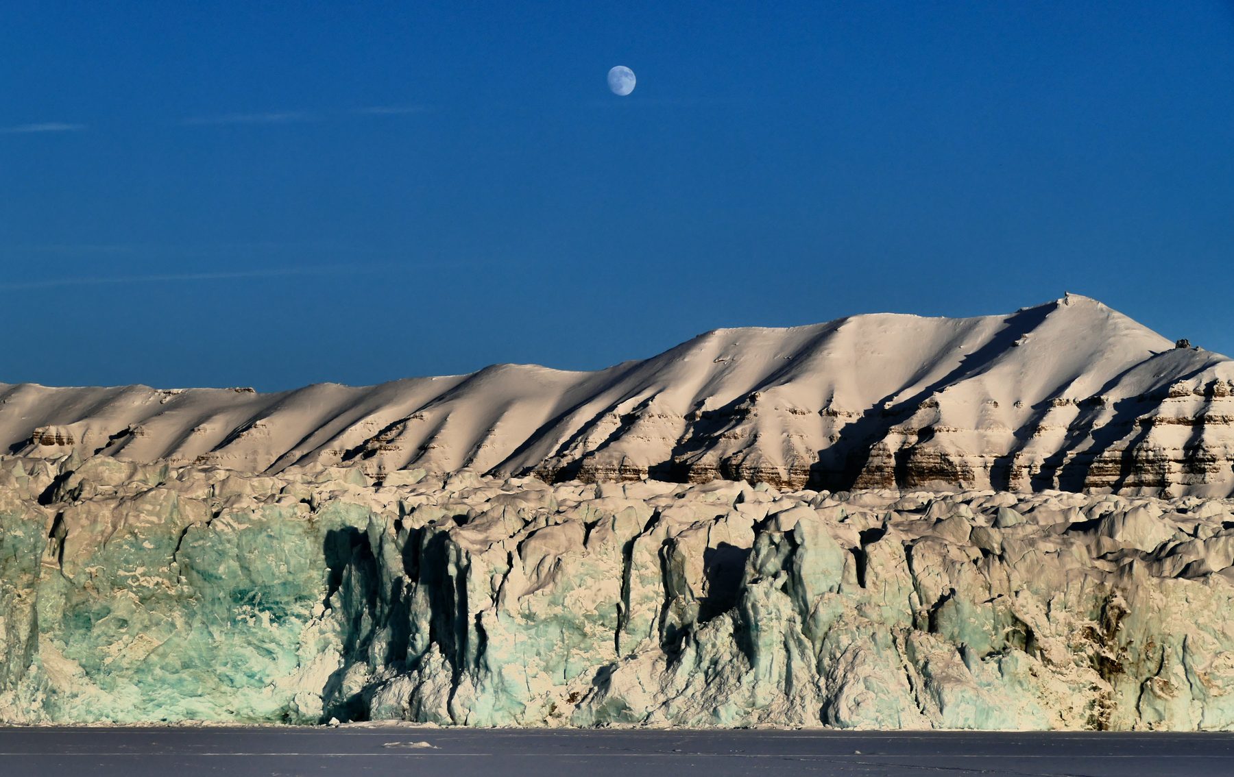 Moon over glacier front