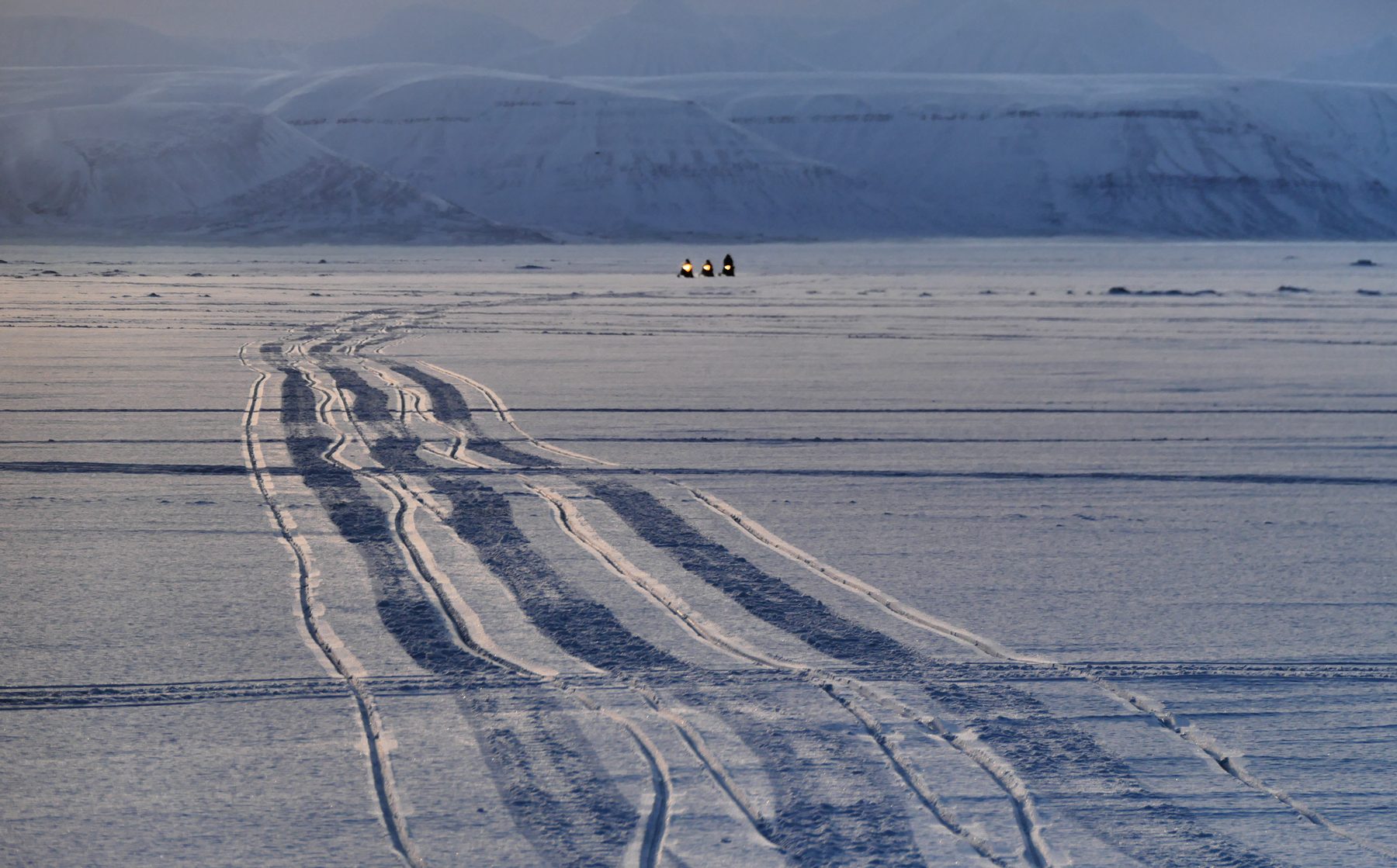 Snow mobiles on sea ice