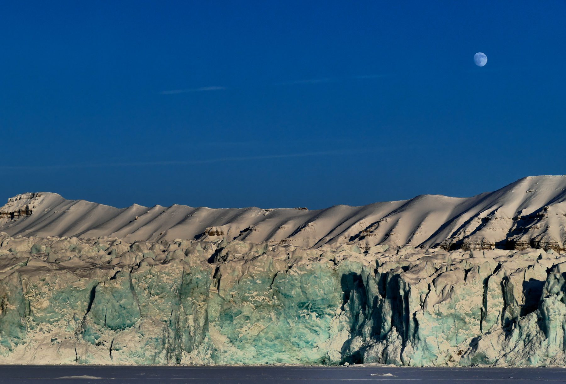 Moon over glacier front