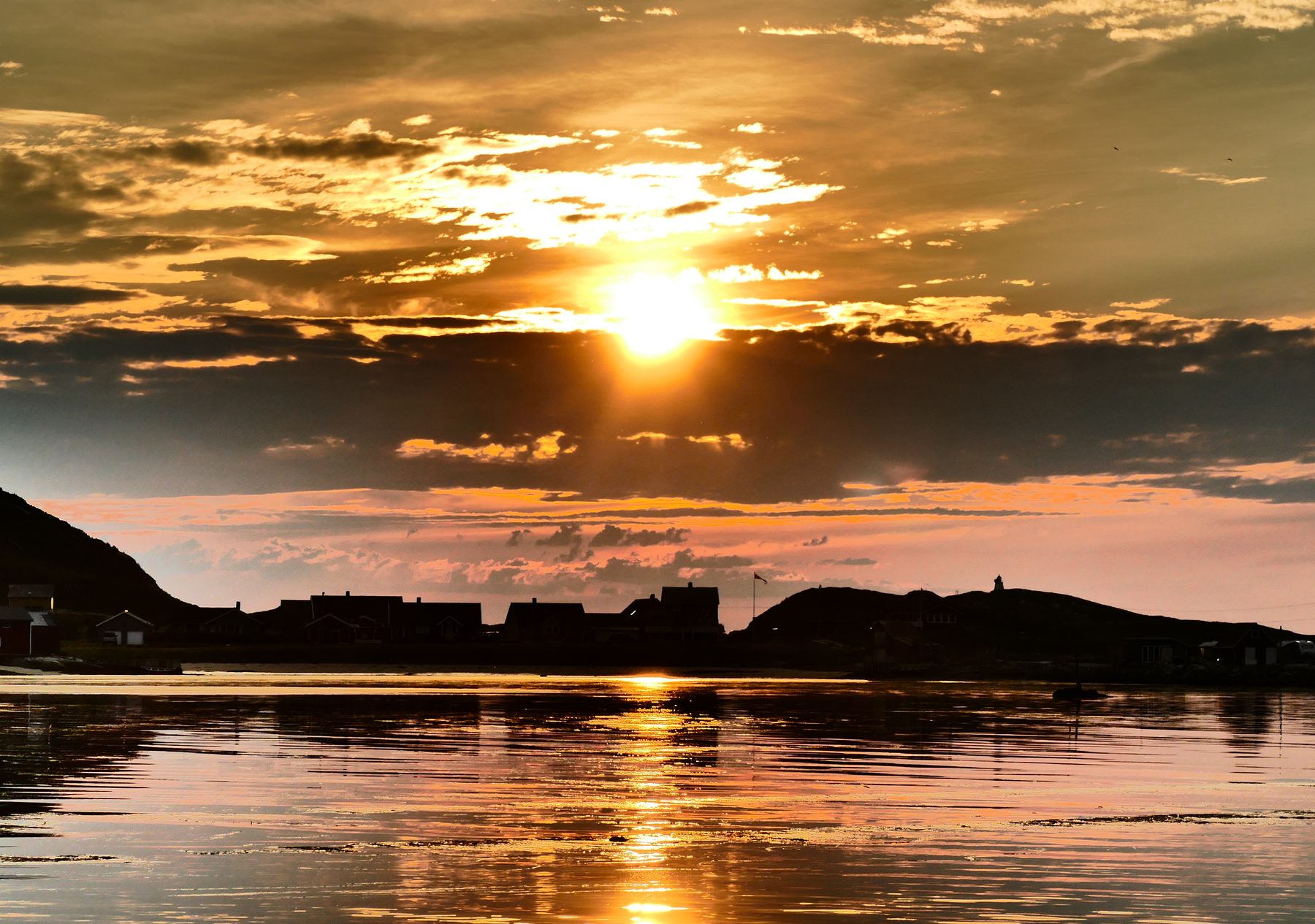 Midnight sun over settlement