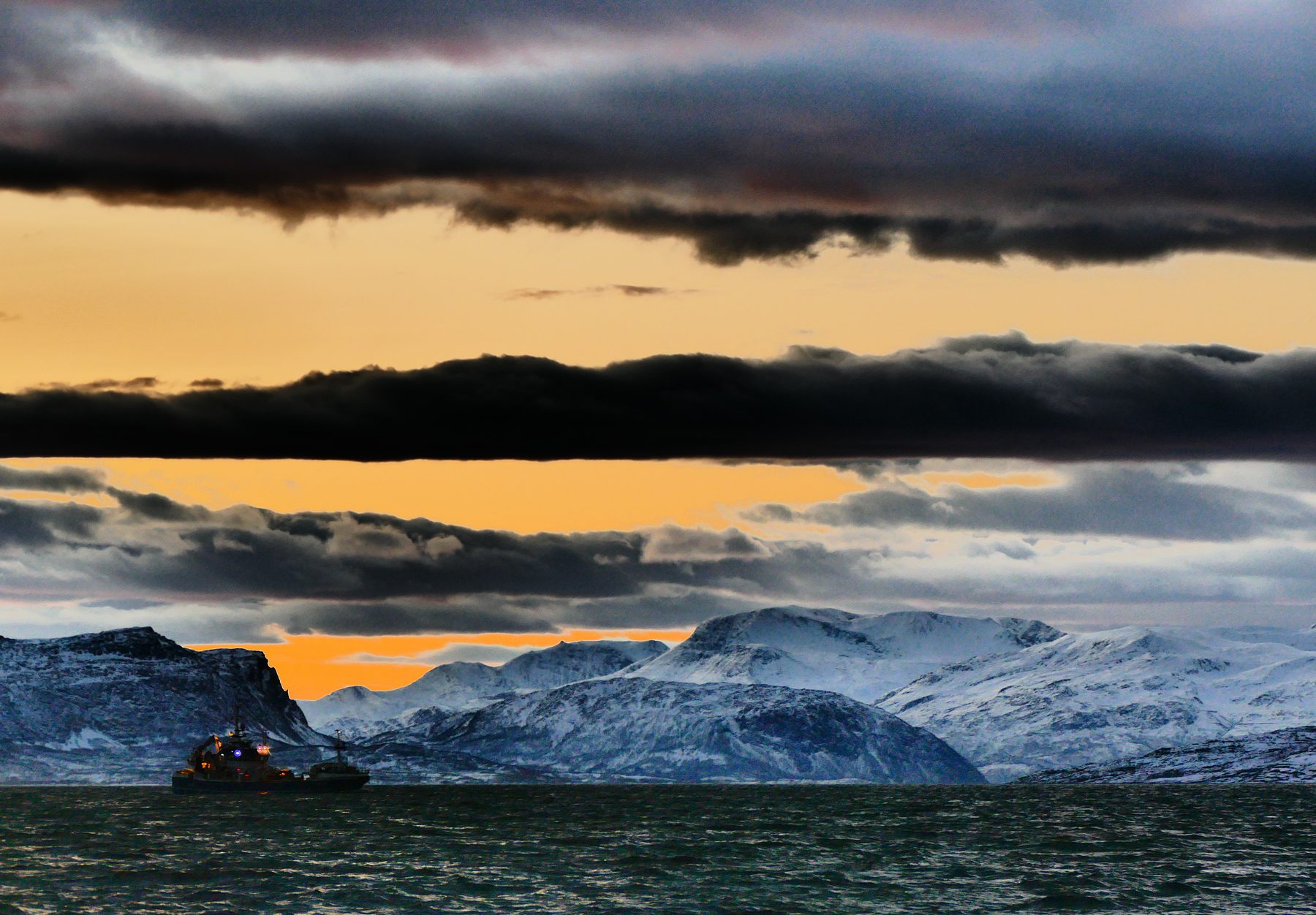 Fishing vessel under evening sky